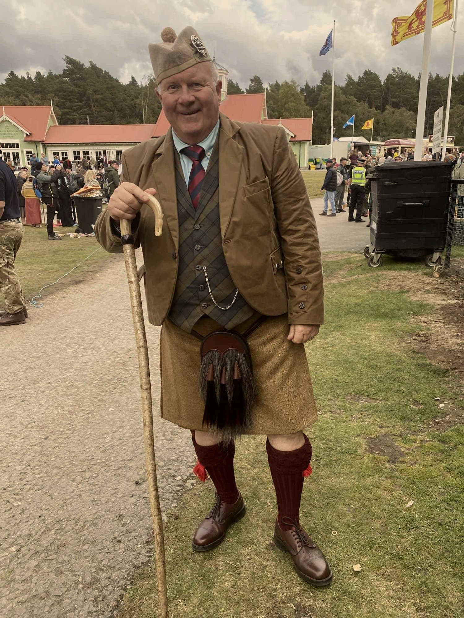 A customer at a Highland games in tweed and kilt