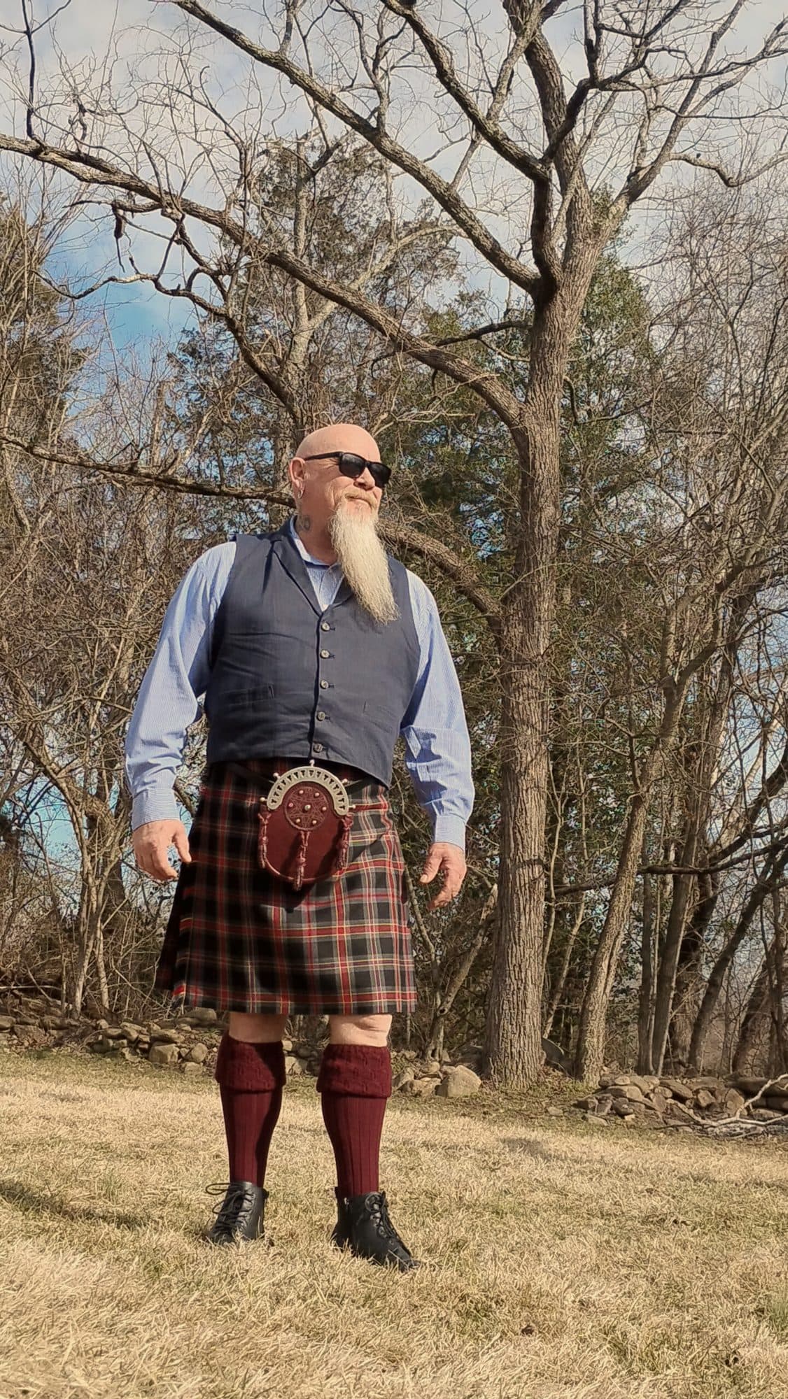 A customer in kilt and waistcoat in the woods
